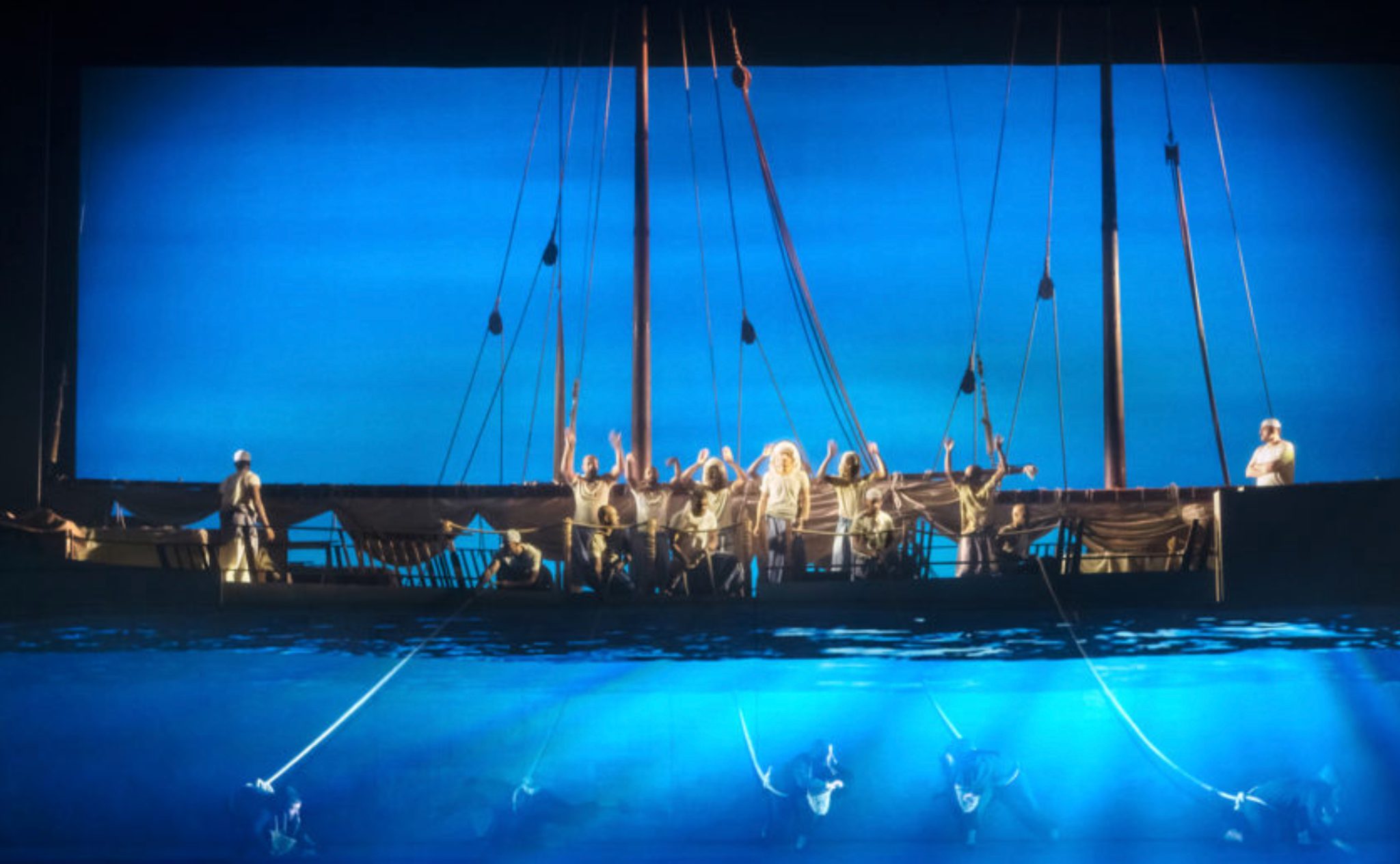 Memoirs of a Sailor II: blue sea imagery surrounds the performers